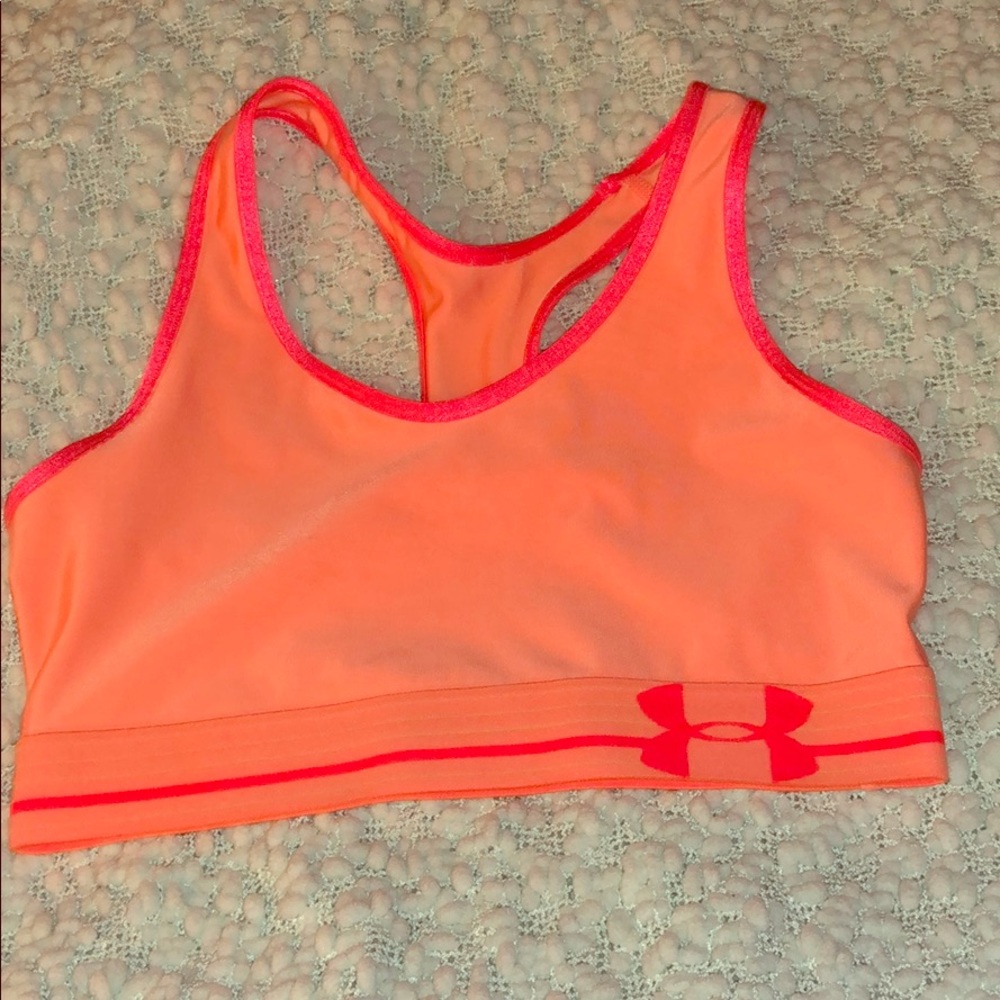 UNDER ARMOR BRIGHT ORANGE SPORTS BRA. NEVER WORN IN BRAND NEW CONDITION.